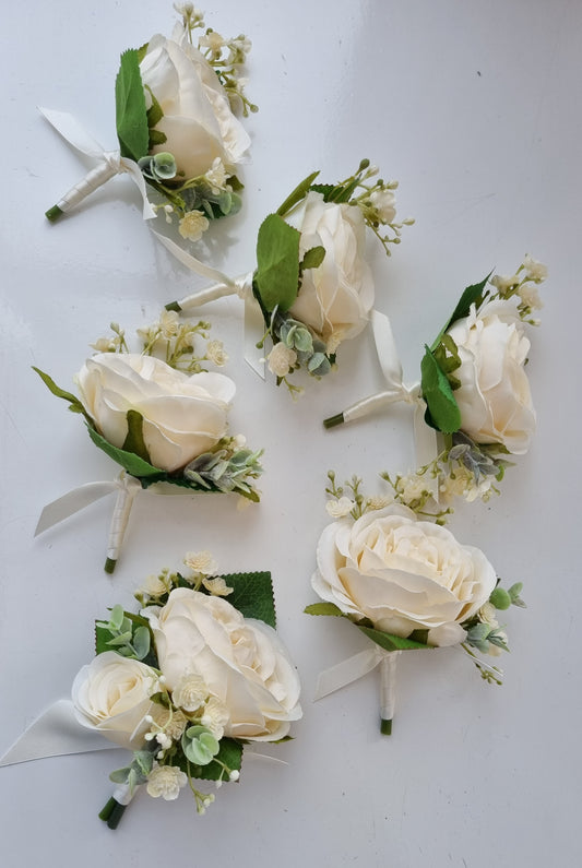 ivory and green artificial wedding buttonholes. Artificial ivory wedding flowers uk